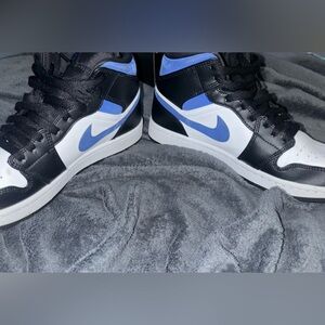White, Blue, and Black Air Jordan 1 Mid